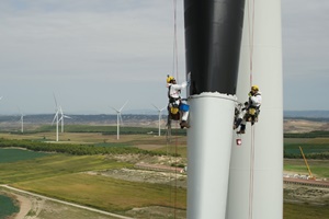 Iberdrola is painting wind turbine blades black and applying vinyl shapes resembling eyes to protect birdlife